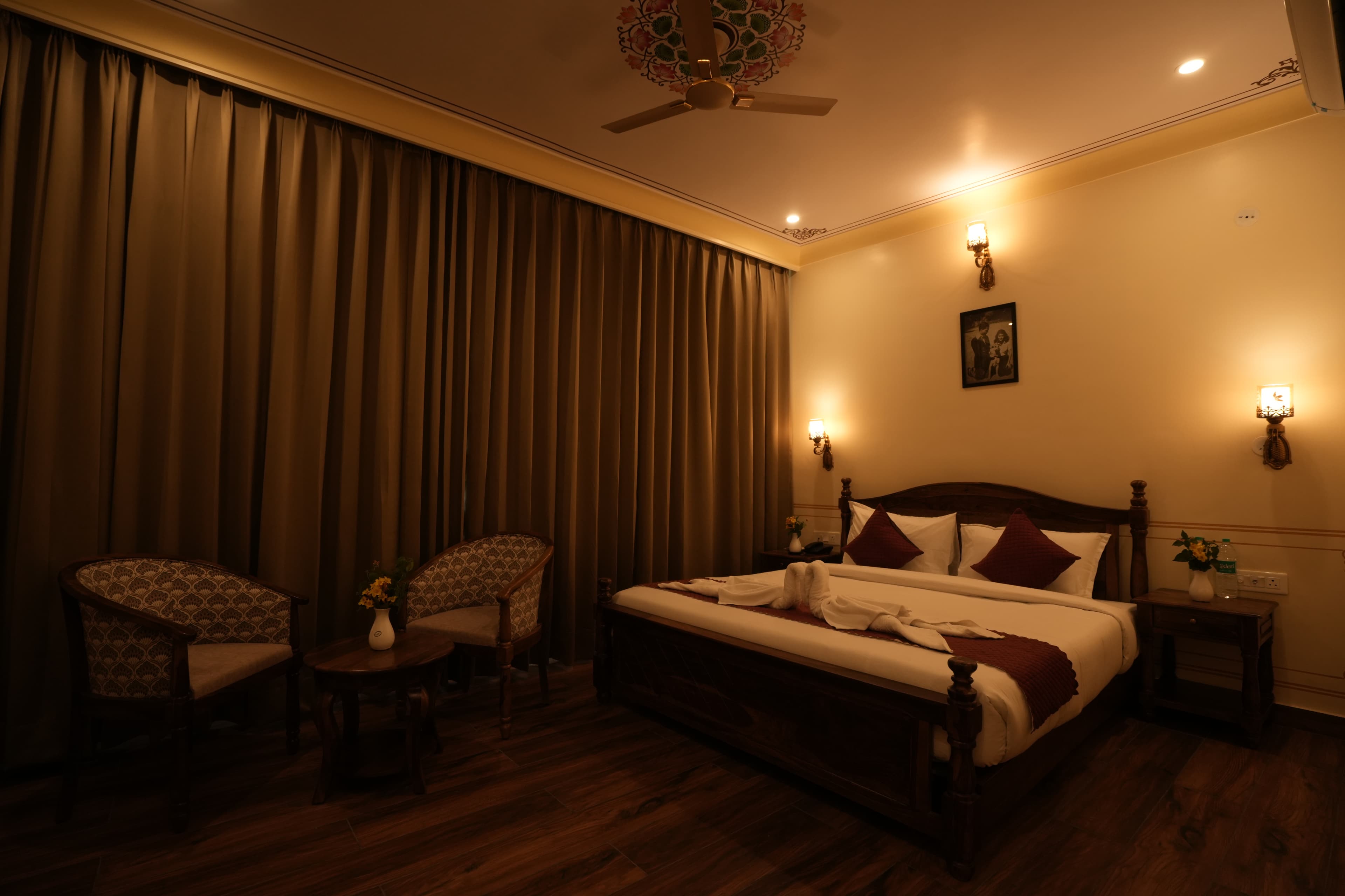 Royal Deluxe Room king bed with Rajasthani decor at The Ummed Haveli Jaipur